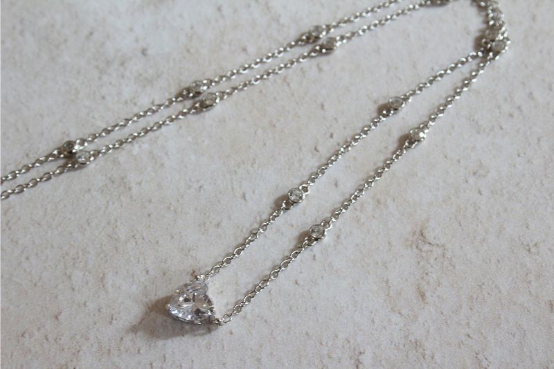 silver CZ station necklace with heart shaped pendant | Carathea