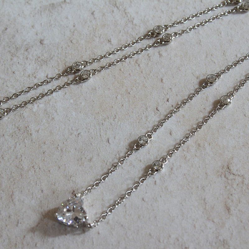 silver CZ station necklace with heart shaped pendant | Carathea