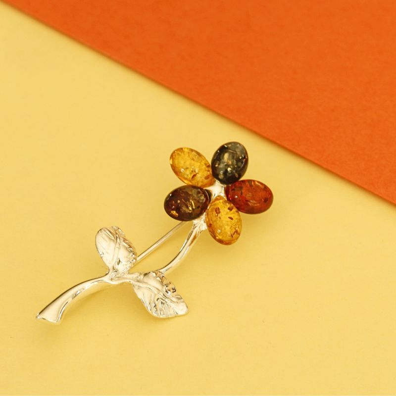 silver flower brooch set with four coloured amber | Carathea jewellers