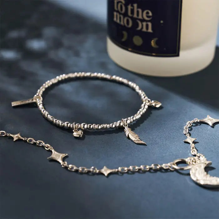 silver beaded bracelet with feather and heart charms - Carathea jewellers