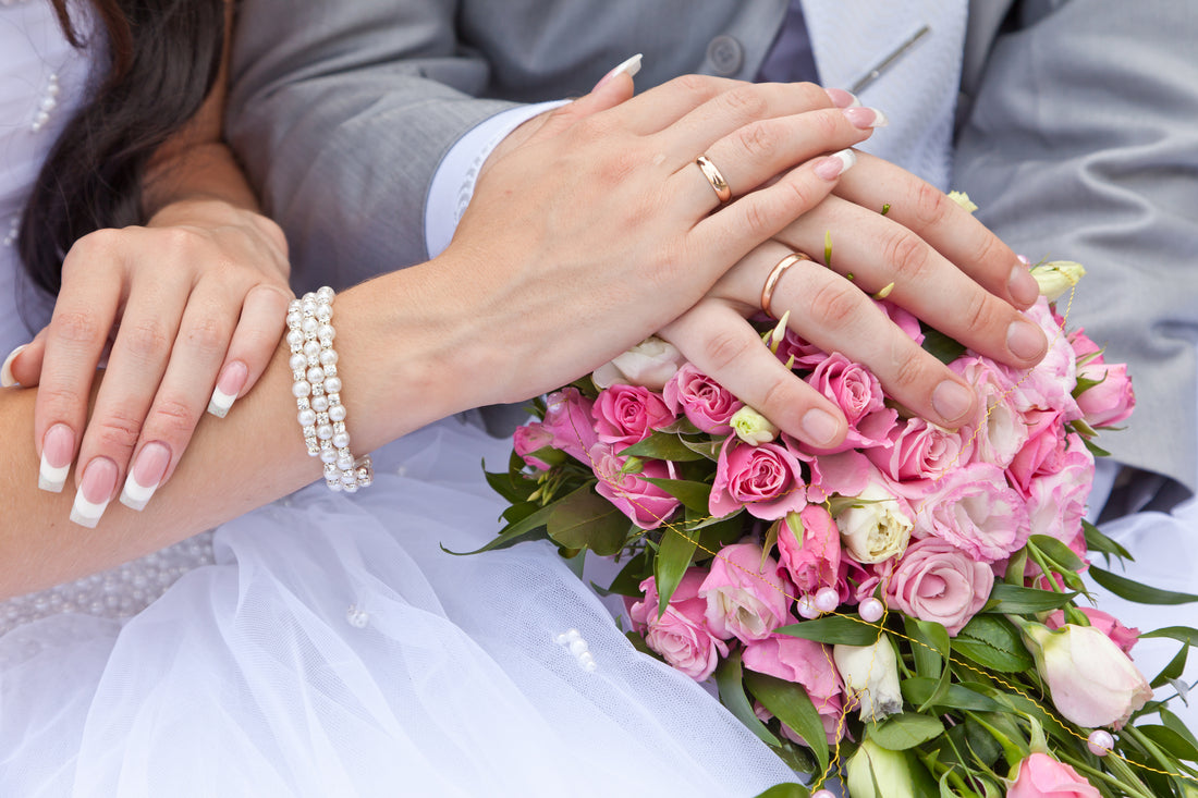 bride and groom on wedding day with jewellery