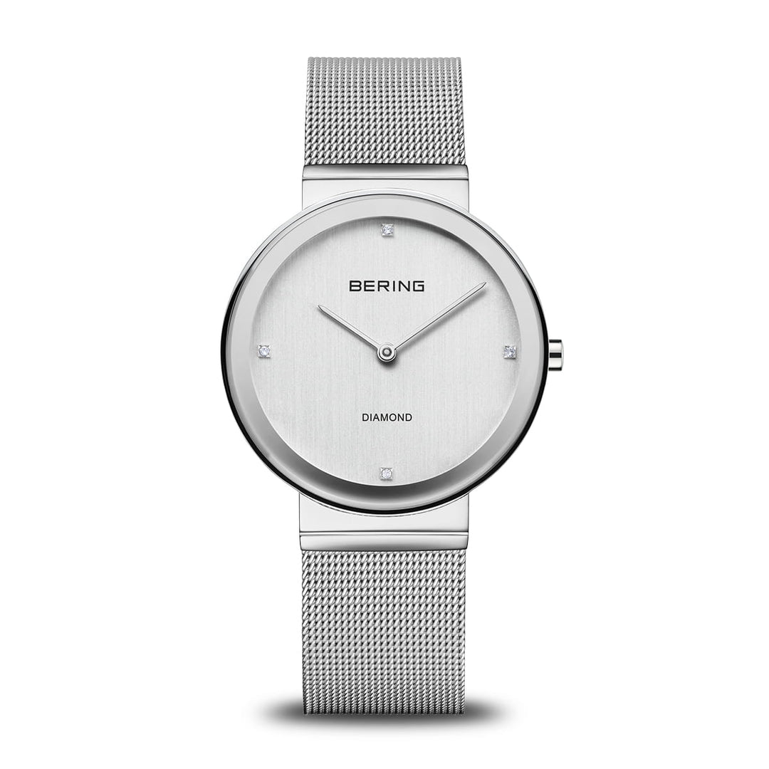 Ladies Bering watch with a silver dial, diamond accents, and Milanese mesh bracelet.