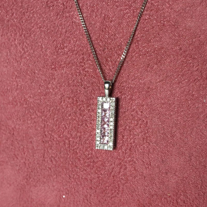 9ct white gold pink sapphire and diamond pendant Jewellery Carathea