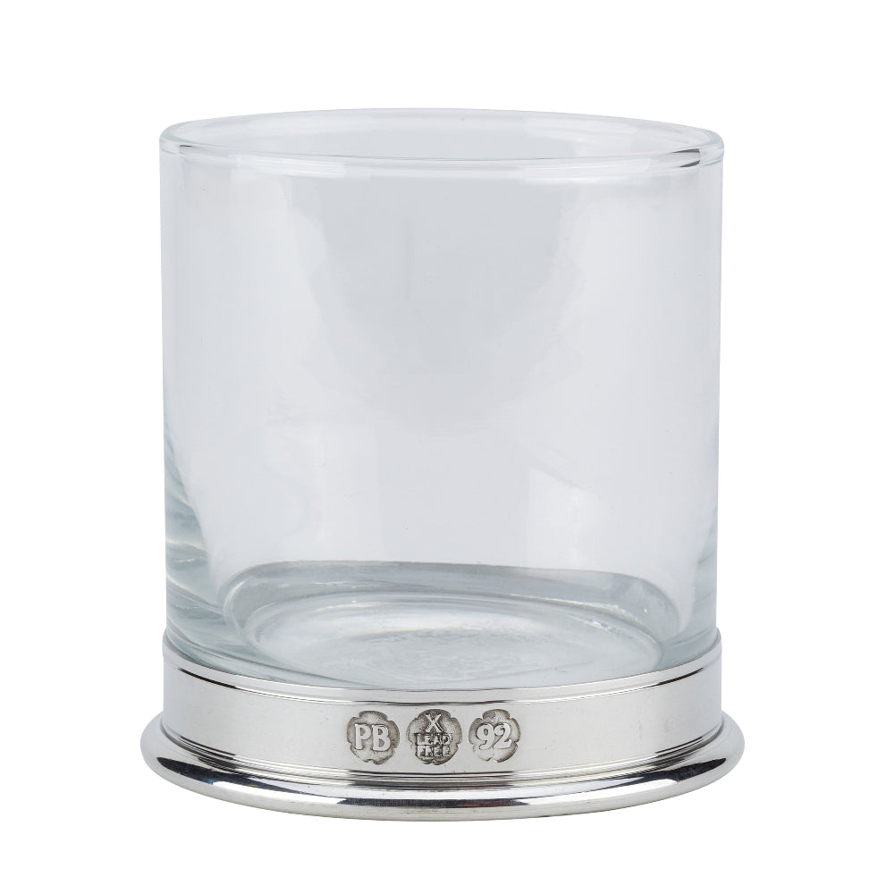 A clear cylindrical glass tumbler with a polished silver-toned metal base, photographed on a plain white background.