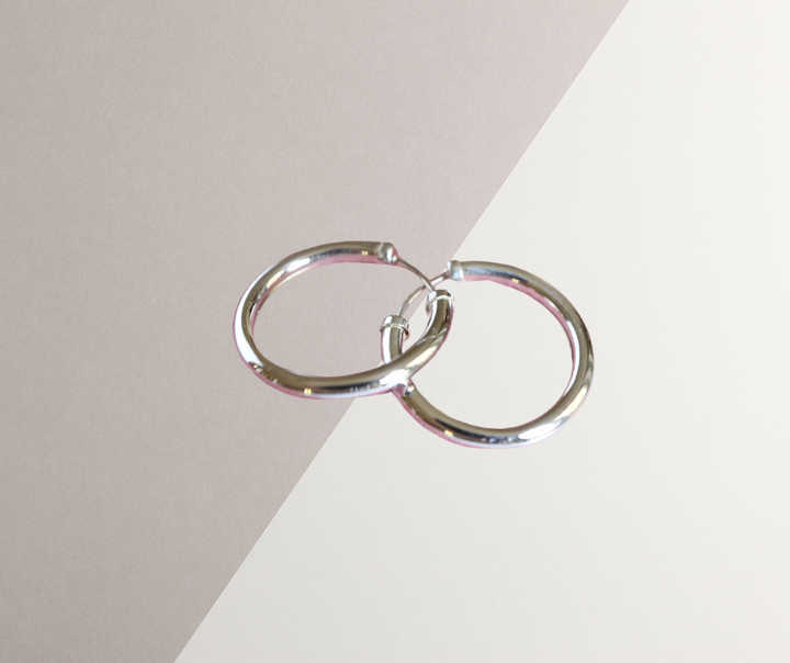 18 mm White Gold Capped Hoop Earrings
