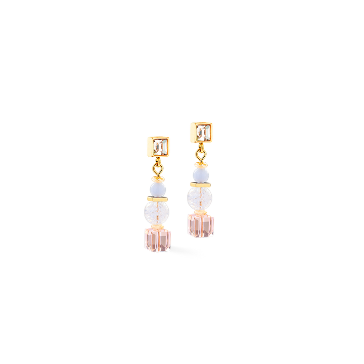 Gold and pastel cube earrings feature sparkling gemstones and crystals designed to gently reflect light.