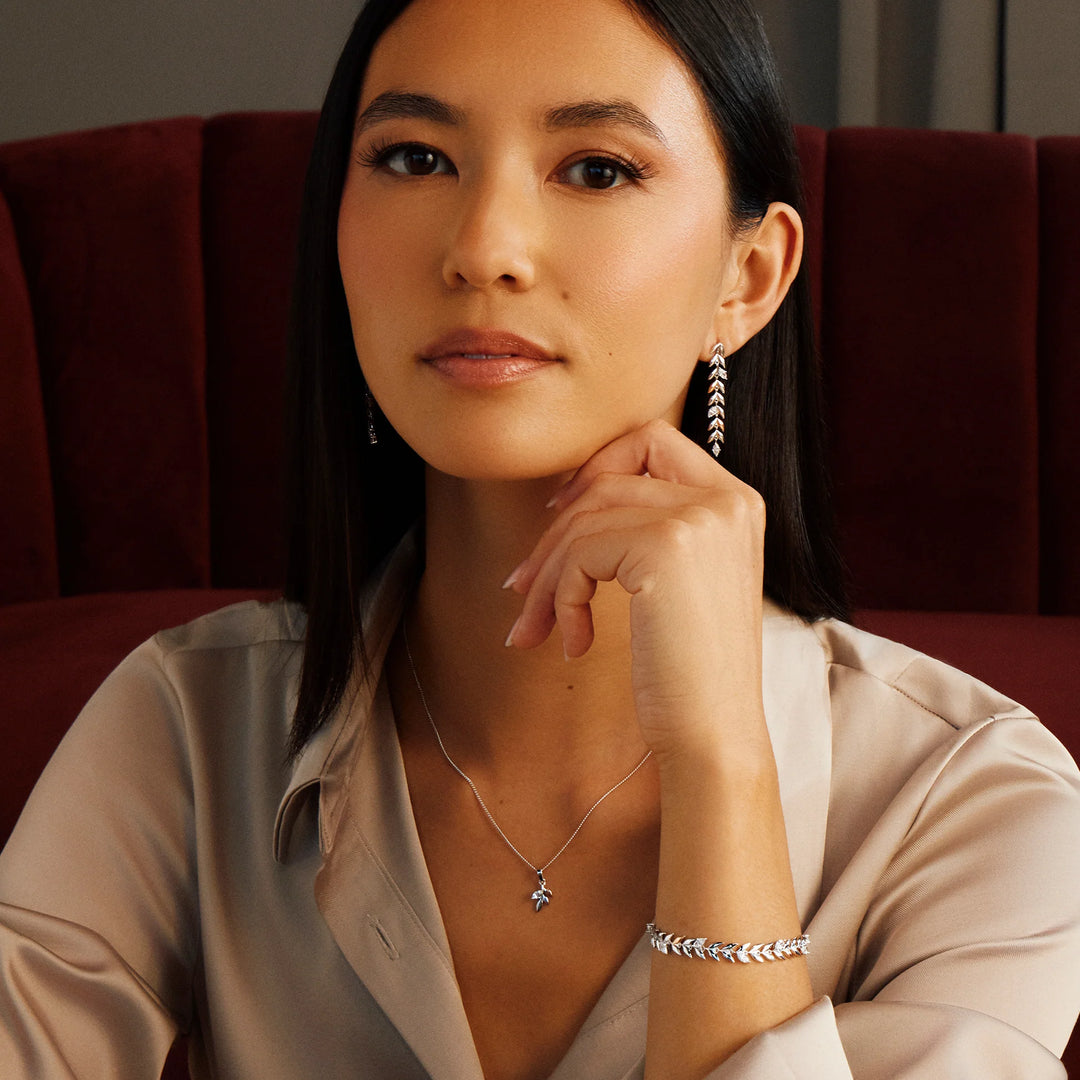Clogau silver & welsh gold leaf t-bar bracelet, pendant and earrings on model - Carathea & Jools authorised stockists