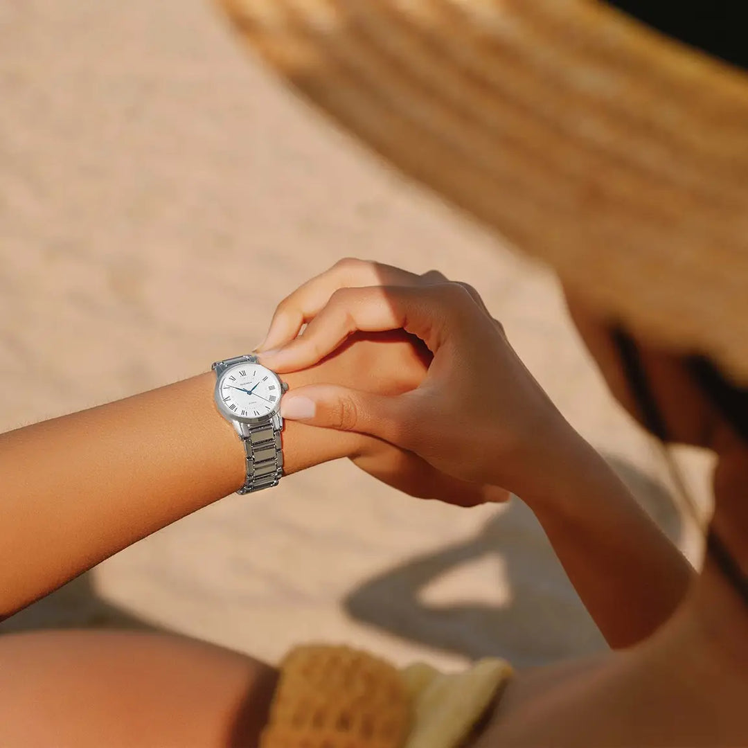 Sekonda silver ladies watch with white dial and blue hands.
