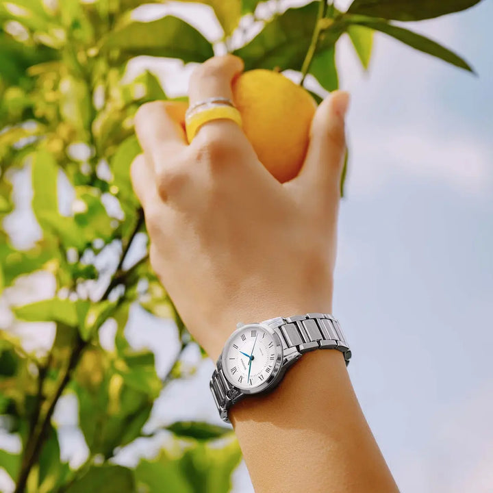 Sekonda silver ladies watch with white dial and blue hands.