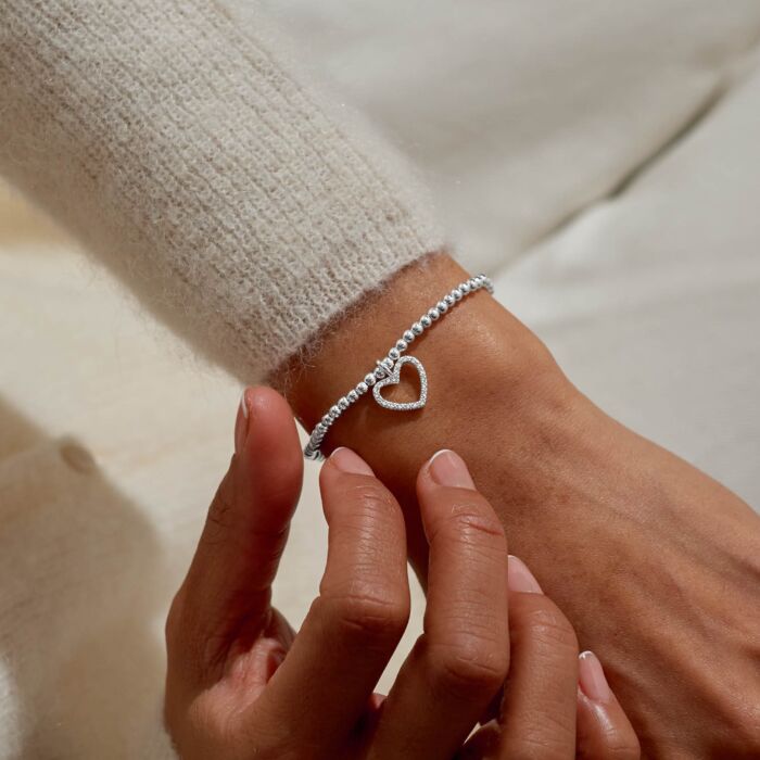 Silver-plated beaded bracelet with a pavé heart charm.