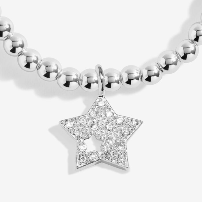 Silver star charm bracelet on a stretch cord.