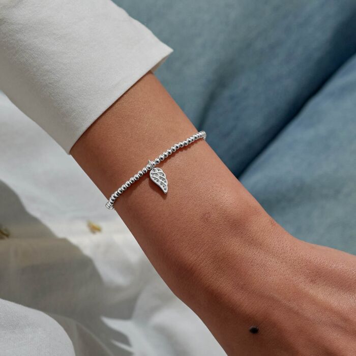 Silver-plated Christmas angel bracelet on a stretch cord.