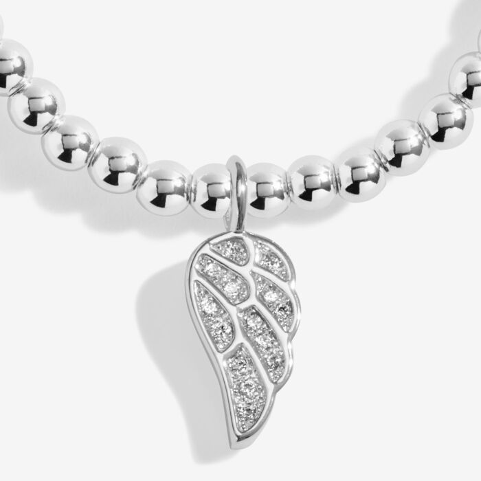 Silver-plated Christmas angel bracelet on a stretch cord.