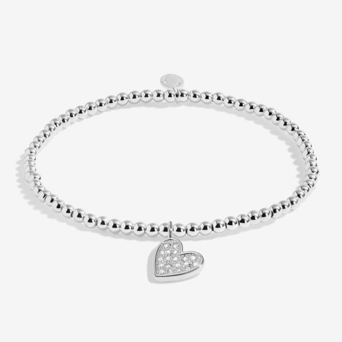 Silver heart charm bracelet with sparkling crystals.