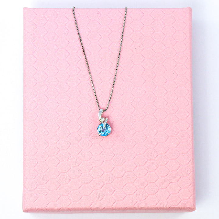 9ct White Gold Blue Topaz & Diamond Twist Pendant