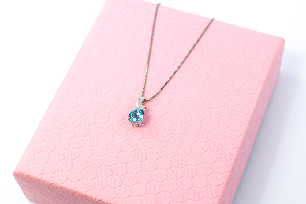 9ct White Gold Blue Topaz & Diamond Twist Pendant