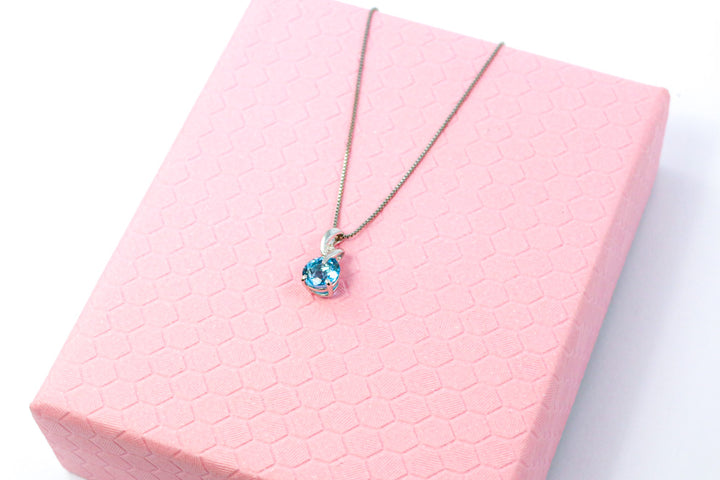 9ct White Gold Blue Topaz & Diamond Twist Pendant