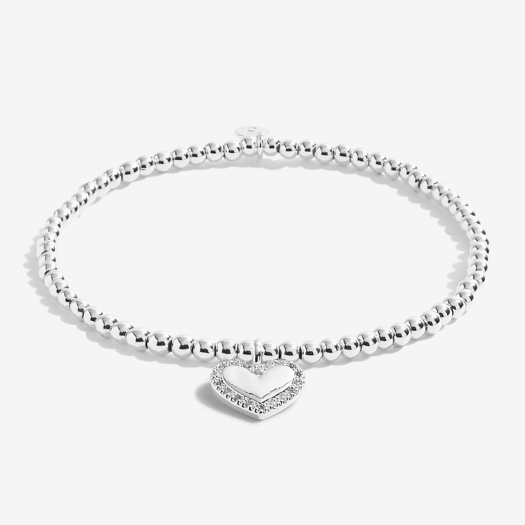 A silver-plated beaded bracelet with heart charm with cz