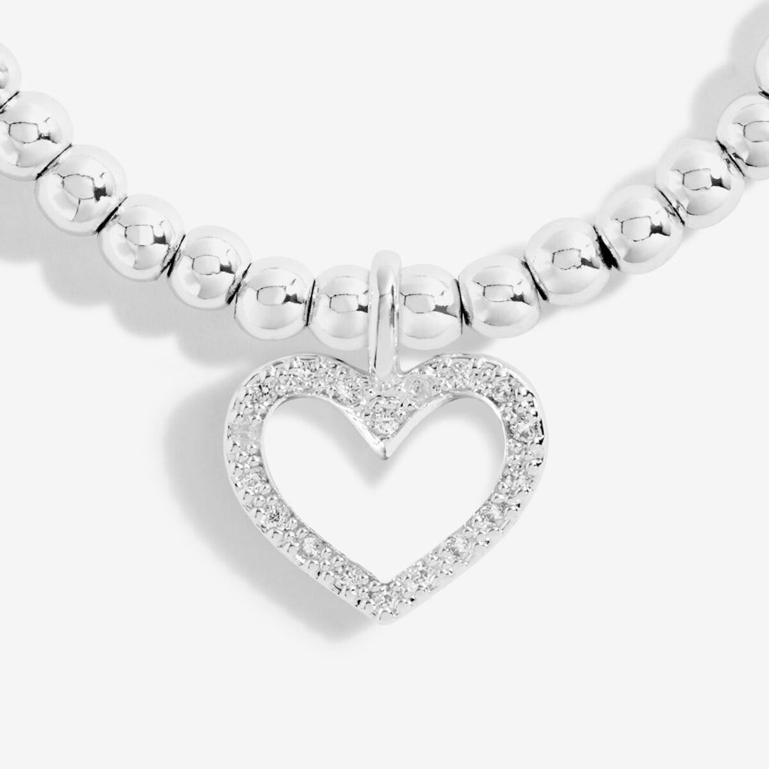 A silver-plated beaded bracelet with heart charm with cz