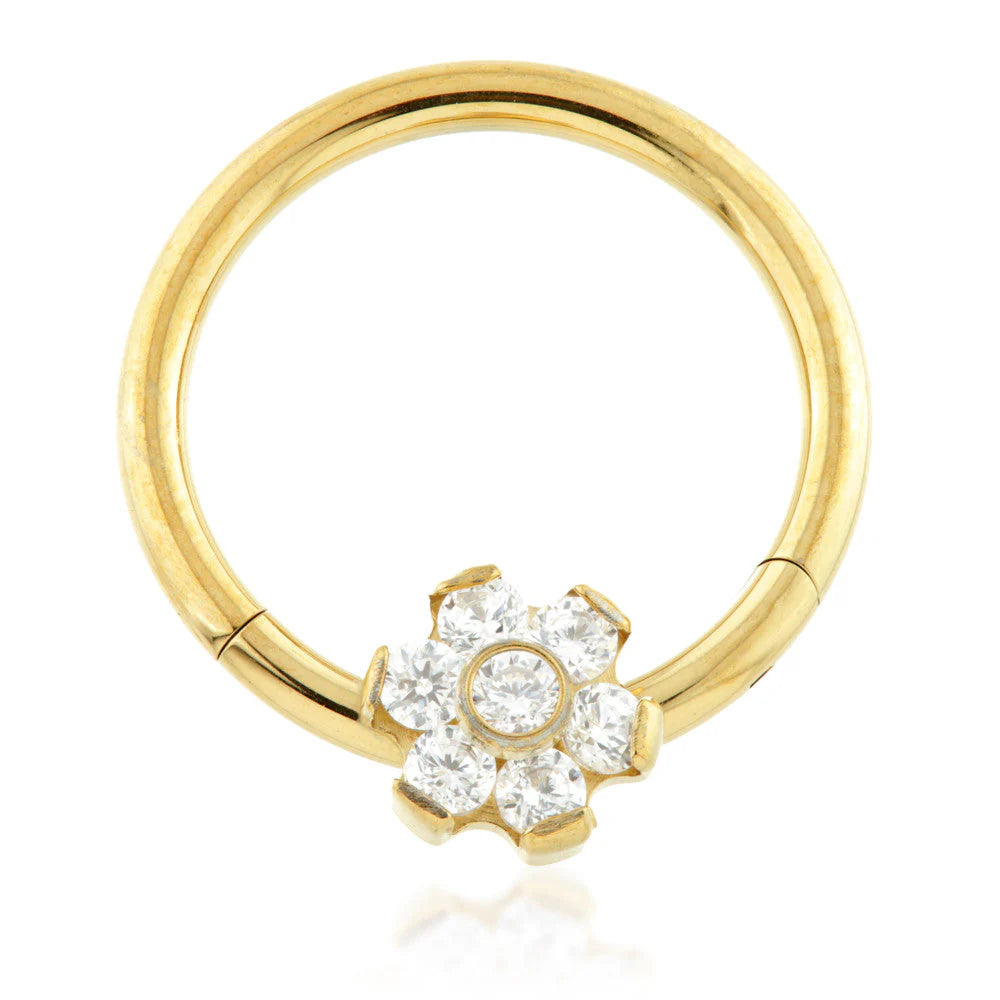 Crystal flower cartilage ring with gold finish.