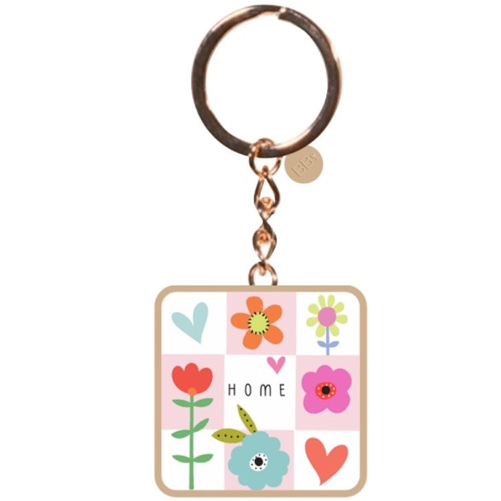 Belly Button Chequer Home keyring: a square fob of pink and white checks with flowers, hearts and the word HOME, on a ring.