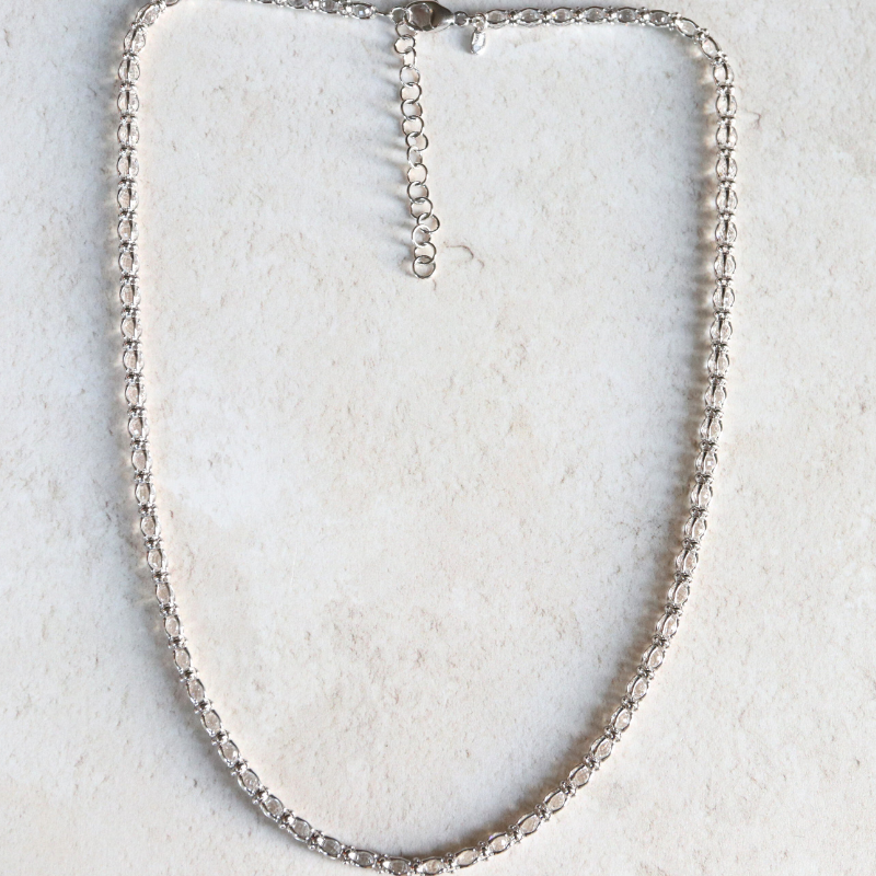 Cubic zirconia tennis necklace in sterling silver.