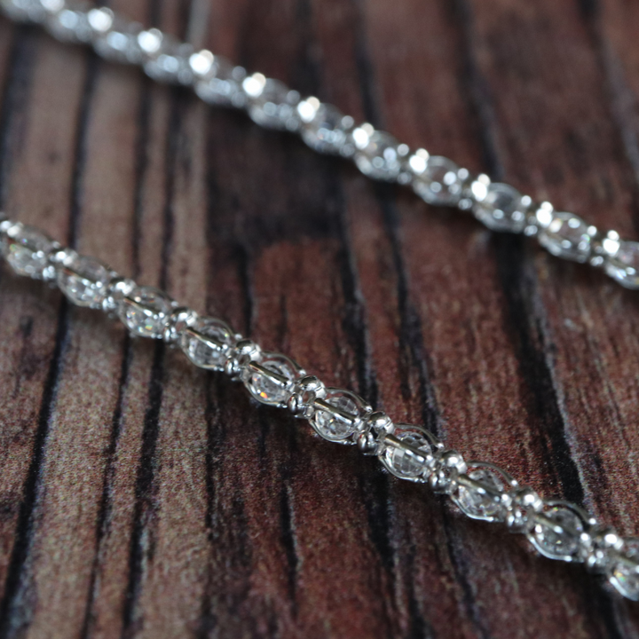 Cubic zirconia tennis necklace in sterling silver.