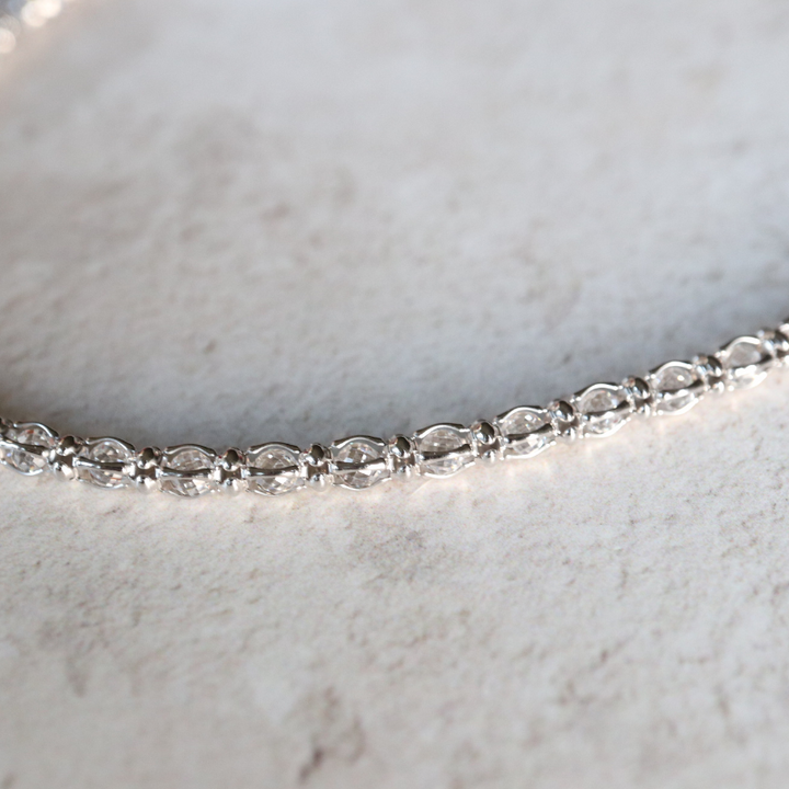 Cubic zirconia tennis necklace in sterling silver.