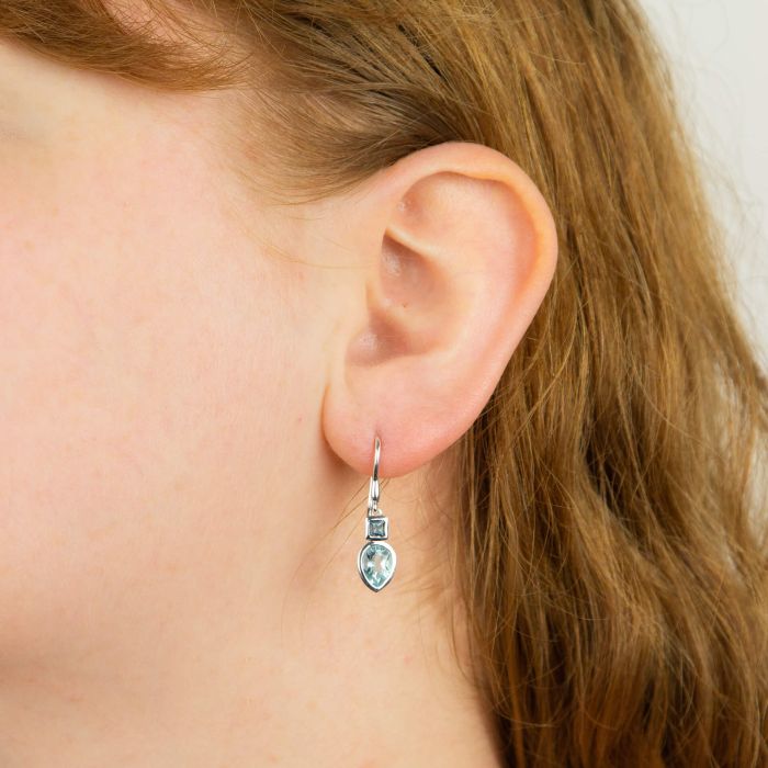 Blue topaz teardrop earrings in sterling silver.