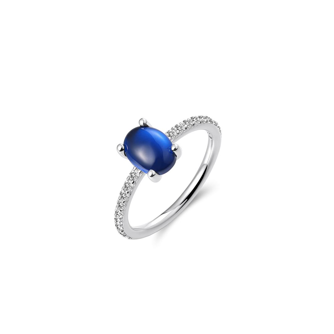 Blue oval stone ring with silver band.