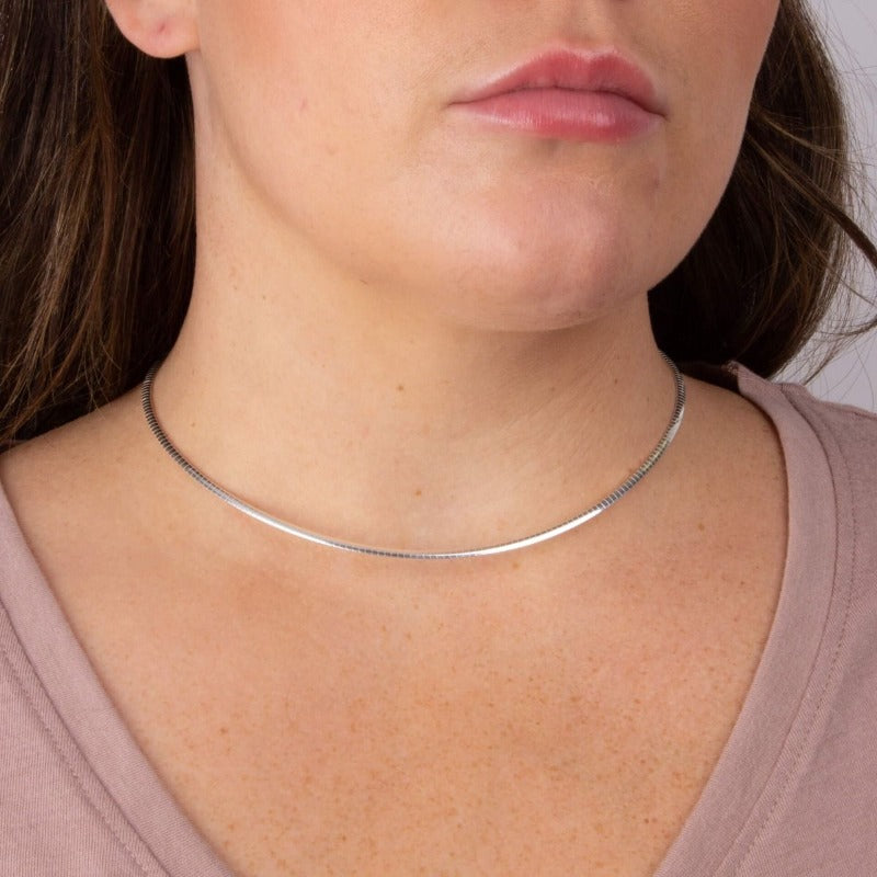 Silver omega necklace on model - Carathea