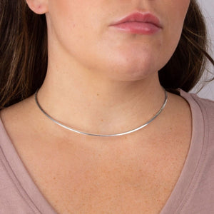 Silver omega necklace on model - Carathea