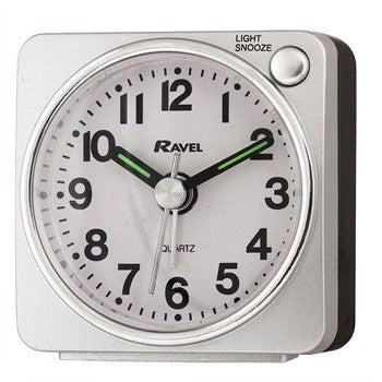 small silver square alarm clock