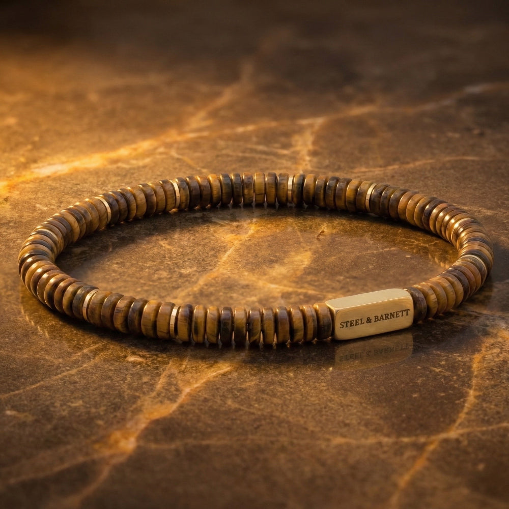 Tiger's Eye Brown beaded bracelet with a visible Steel & Barnett brand name on a textured brown background