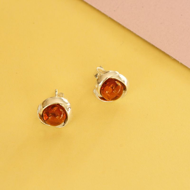 round stud amber earrings with silver twisted rope surround | Carathea