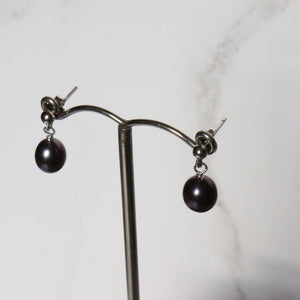 silver drop earrings with black barrel shaped river pearl - Carathea jewellers