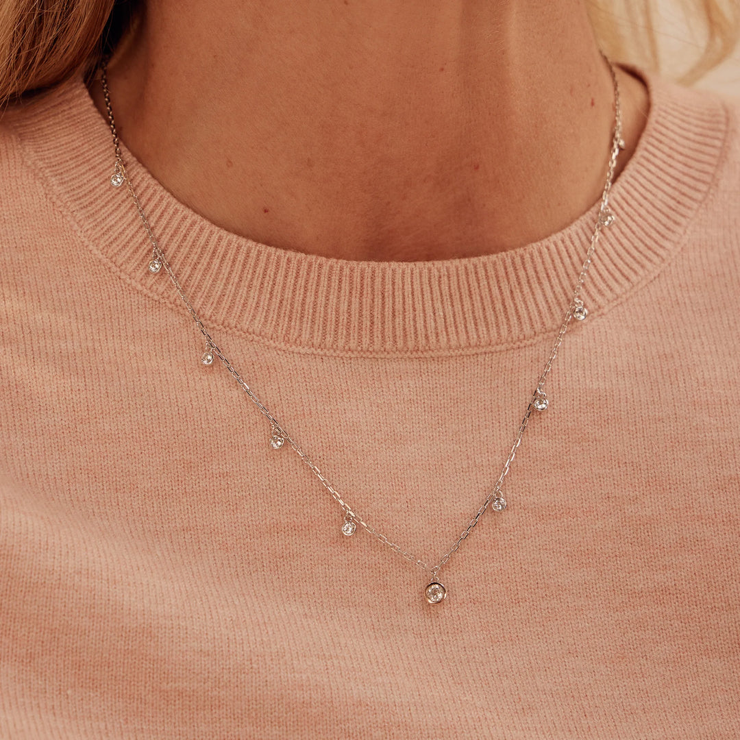 Clogau Celebration necklace with white topaz on model - Carathea at Jools Jewellers