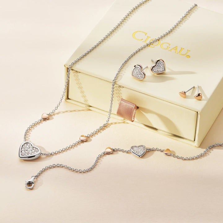 These are rose gold heart earrings made of sterling silver with a touch of rare Welsh gold.