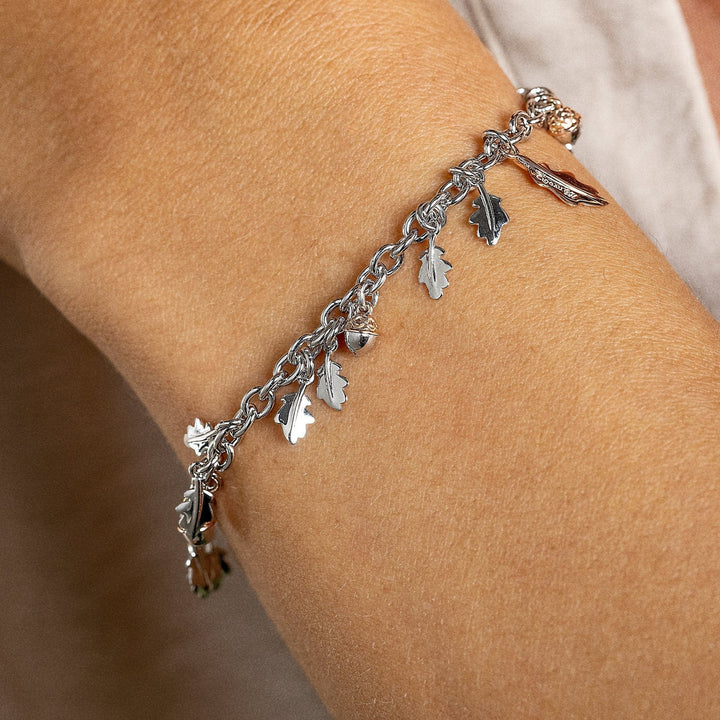 Silver and rose gold oak leaf bracelet with white topaz.