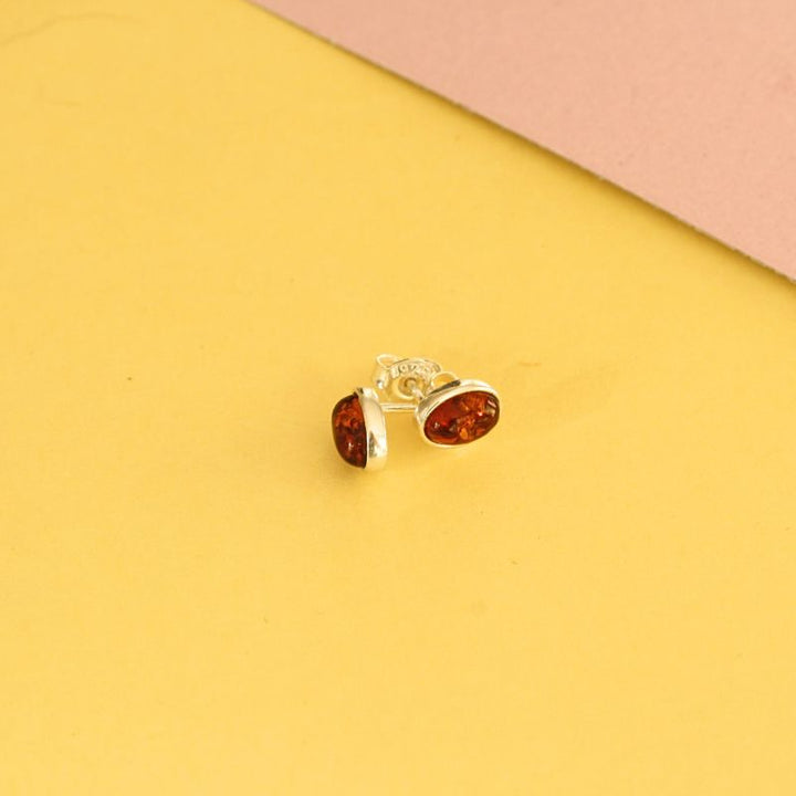 silver oval amber stud earrings | Carathea