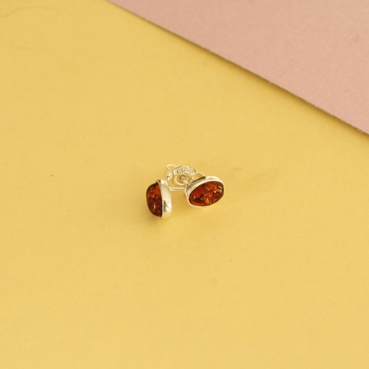 silver oval amber stud earrings | Carathea