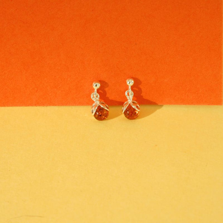 silver amber ladybird drop earrings | Carathea