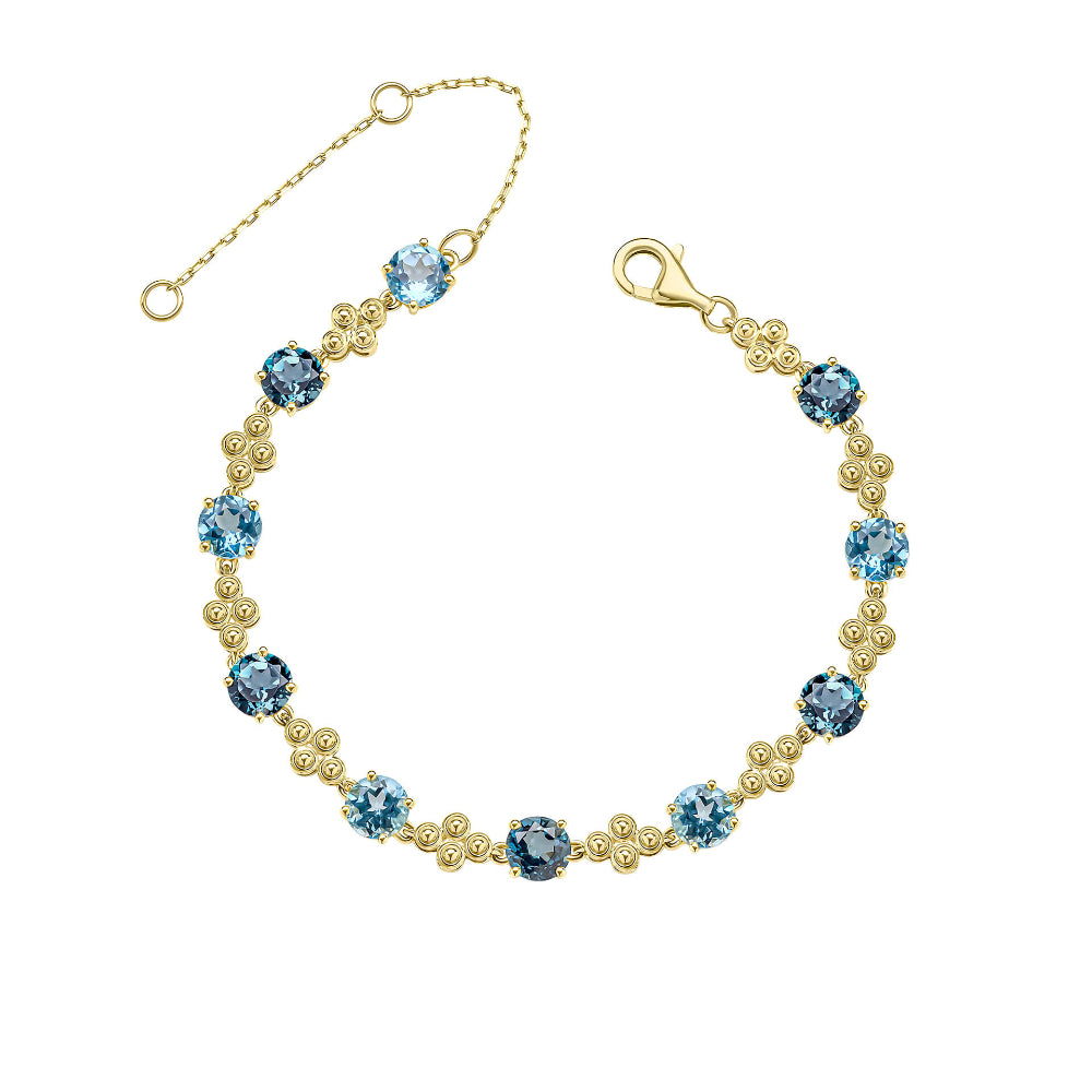 9ct yellow gold bracelet set with Swiss and London blue topaz stones, shown in full.