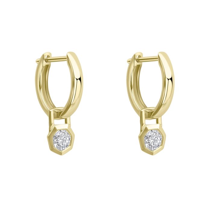 Gold hoop earrings with small round gemstones in a hexagonal charm on a white background