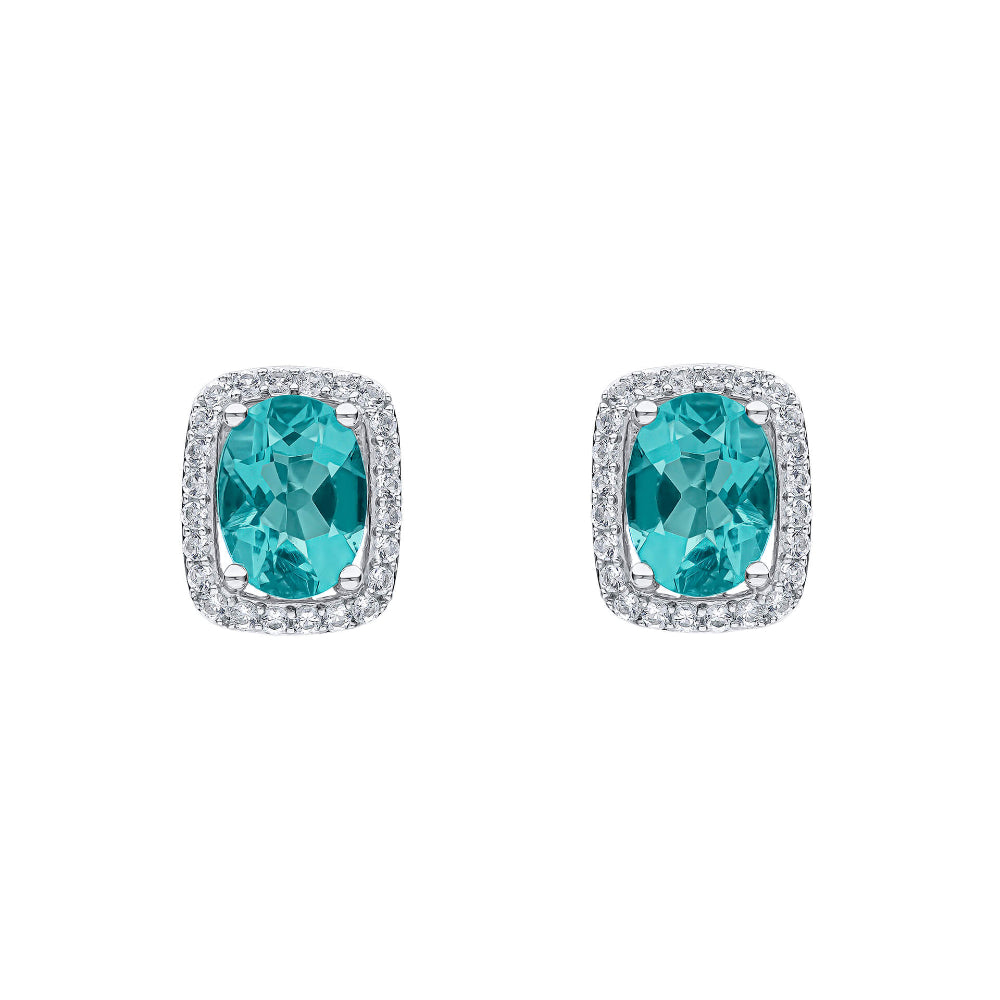 9ct white gold stud earrings, each with an oval blue fluorite held in four claws inside a rectangular white topaz halo.