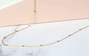 gold find trace and bead station necklace - Carathea jewellers