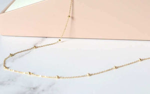 gold find trace and bead station necklace - Carathea jewellers