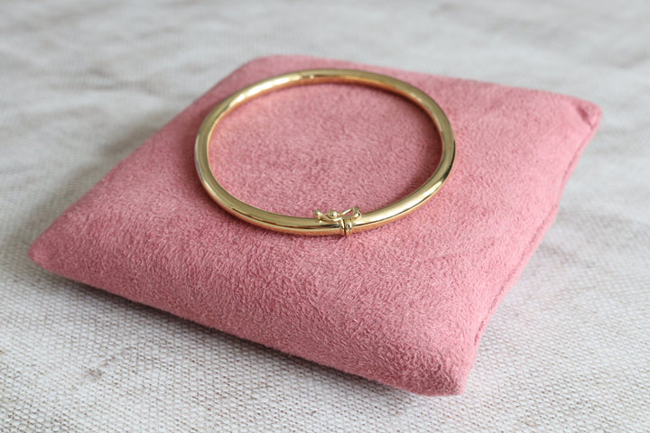 3mm thick gold oval bangle with a secure clasp - Carathea Jewellers