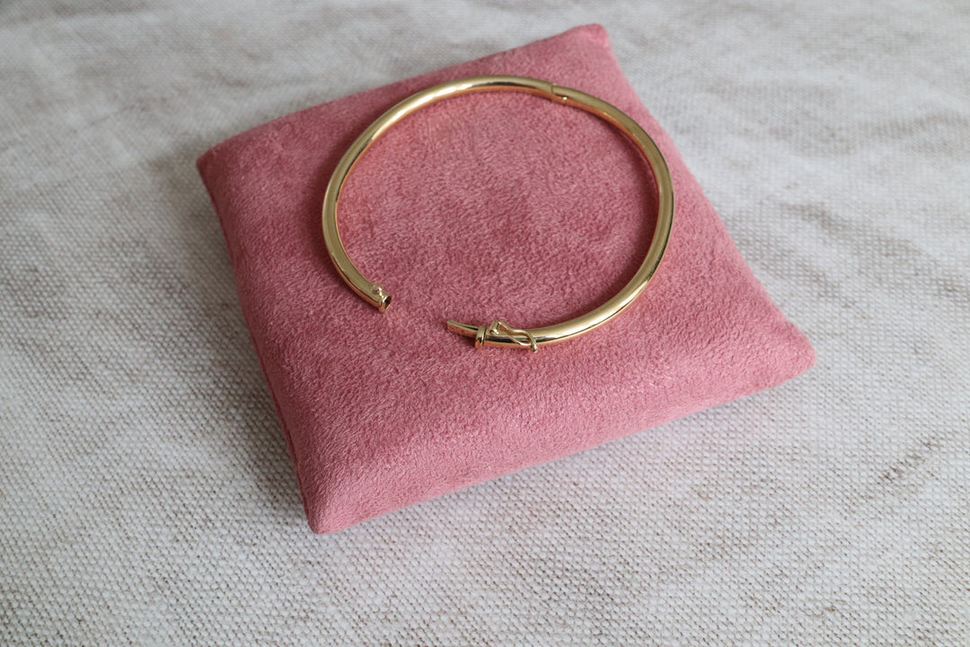 3mm thick gold oval bangle with a secure clasp, with hinge opening for easy wearing - Carathea Jewellers