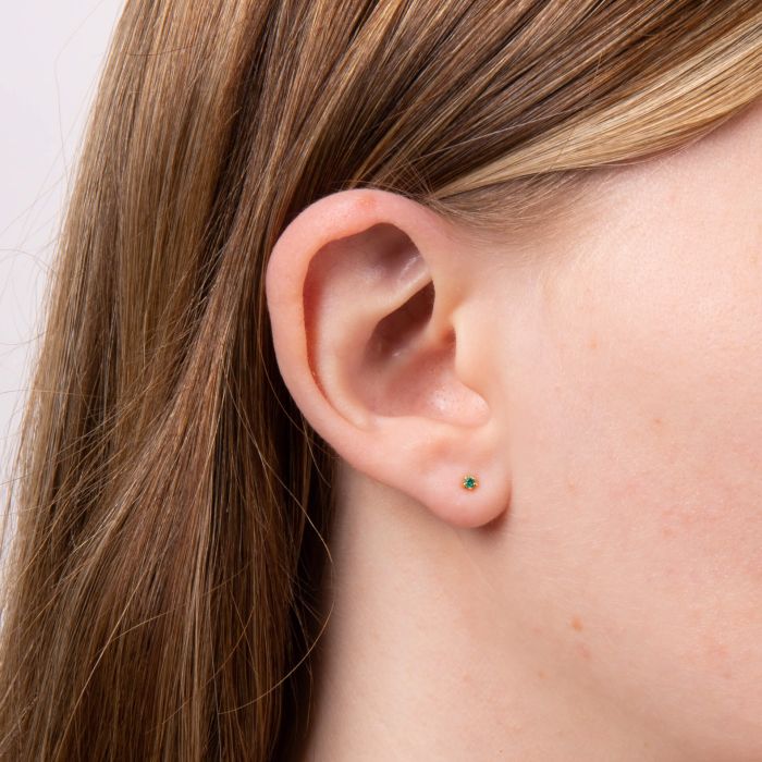 model wearing gold plated green crystal tiny stud earrings - Carathea